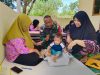 Dukung Peningkatan Kesehatan Masyarakat Babinsa Temajuk Dampingi Nakes Laksanakan Posyandu Di Wilayah Perbatasan
