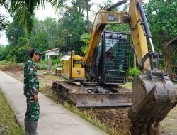 Percepatan Pembangunan Satgas TMMD Reguler ke-129 Ratakan Sasaran Rabat Beton Gunakan Alat Berat