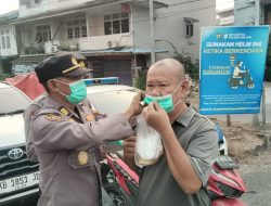 Cegah ISPA Akibat Kabut Asap Polres Melawi Bagikan Masker Kepada Masyarakat